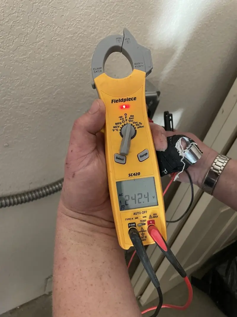 Voltage testing with clamp meter during Outlet Installation in Cotulla